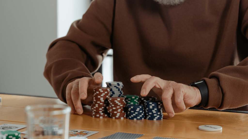 Gambler holding casino chips